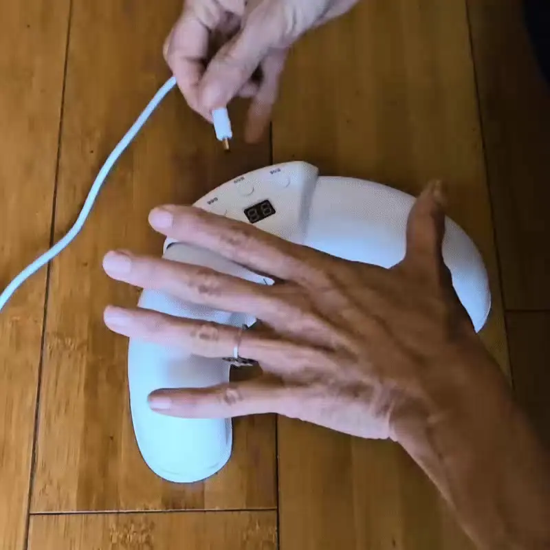 Individual experiencing foot discomfort before discovering the Fungabeam health and wellness solution for nail care
